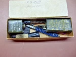 Box Of Miscellaneous Rifle Cleaning Tools Old National Guard Tins Oil Brushes. Fixed Price $15.99.