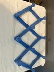 Vintage Blue Plastic Accordion Peg Rack Shelf Expandable Folding Hat Coat. Fixed Price $20.23.