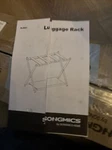 Songmics Luggage Rack, Suitcase Stand With Fabric Storage Shelf, For Black. Fixed Price $35.00.