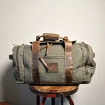 Kodiak Canvas & Leather Duffle Bag 19"-22" Green/brown Adjustable Straps. Fixed Price $180.00.